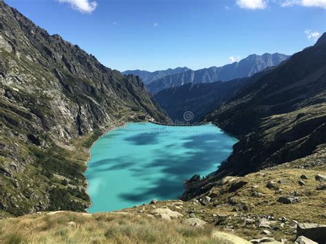 Beautiful View Of Blue Alpine Lake High In Mountains With Turquoise
