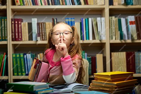 Premium Photo Child Girl Asks To Be Quiet In Library School Child
