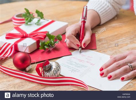 We did not find results for: young woman writing christmas cards with red nails, a red ...