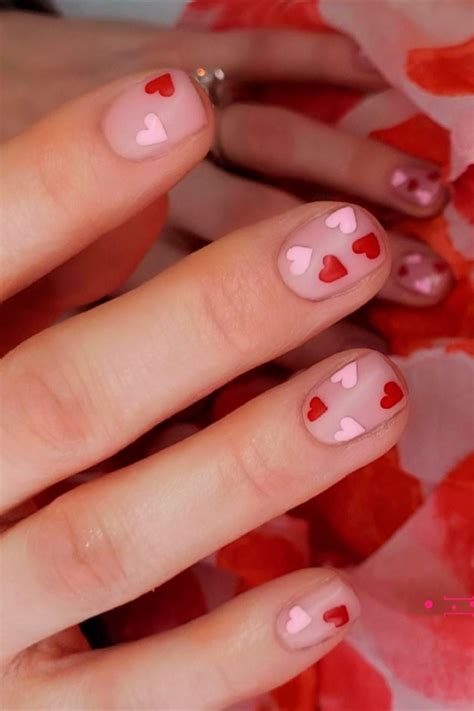 Cute Short Valentines Day Nails 2021 Consists Of Red And Pink Heart Shaped Nail Art Design