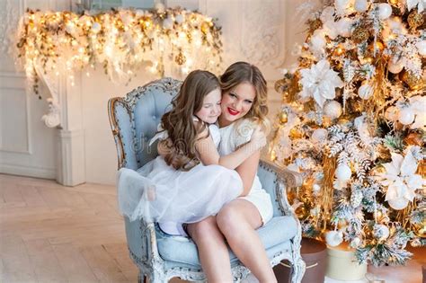 Mother And Daughter Near A Christmas Tree Stock Image Image Of