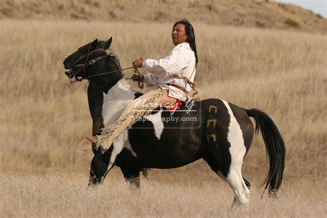 A Native American Indian Riding Bareback On His War Marked Painted