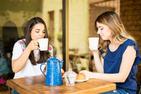 Two Women Having Coffee Together Stock Photo Image Of Relaxing Young