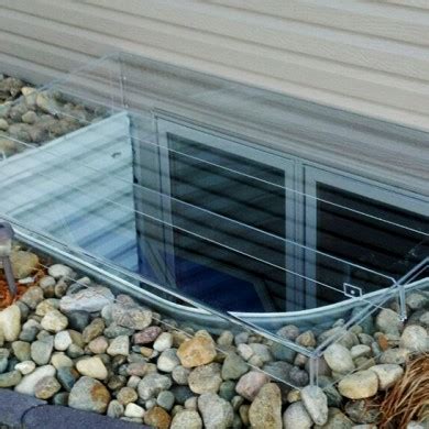 Products > residential > egress window wells > window well covers > window well covers keeps window well area clean of snow, leaves and debris. Acrylic Egress Window Well Covers - Custom Plastics, Fargo ND