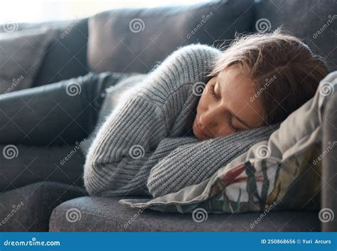 Life Can Be So Bleak Shot Of A Young Woman Lying On Her Couch Feeling
