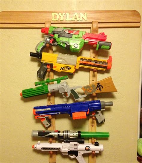 Used various hooks, wood screws, and nails to mount the guns. Nerf storage ideas! - A girl and a glue gun