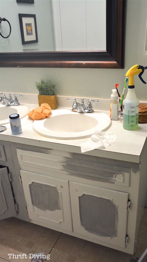 Step 1 lay drop cloths on the floor around the bathroom cabinets to protect it from sanding dust and paint. BEFORE & AFTER: My Pretty Painted Bathroom Vanity