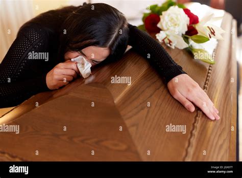 Woman With Coffin Crying At Funeral In Church Stock Photo Alamy