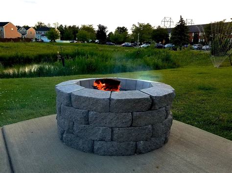 This smokeless fire pit is roughly 2 feet wide, which is plenty of room to accommodate standard fire logs—and make no mistake, when filled, it produces high flames and a tremendous amount of heat. DIY Firepit | Diy fire pit, Concrete patio