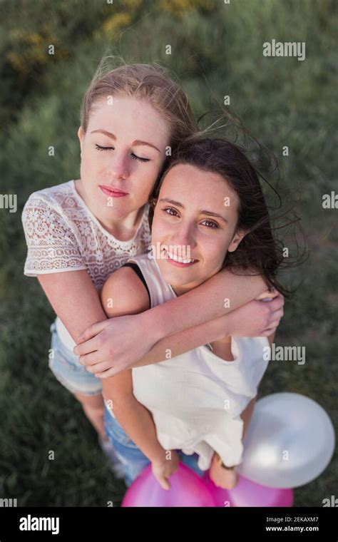 Female Friends Embracing Stock Photo Alamy