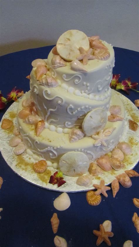 White chocolate seashells dusted with super pearl dust. #Beachtheam #CakesandGoodies #seashells #wedding #White ...