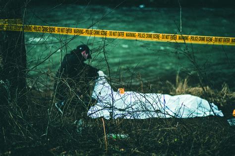 Detective Investigating Crime Scene By The River Police Chief Magazine