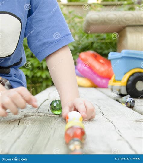 Child Playing Marbles Stock Photo Image Of Hands Youth 31252782