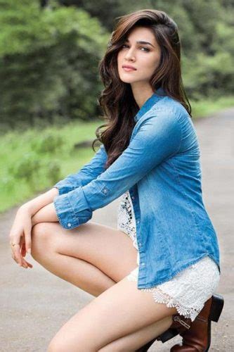 Kriti Sanon Is Looking Extremely Desirable In This White Dress With Blue Shirt Hot And Sexy