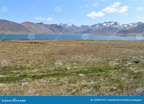 The Street With Mountains And A Blue Lake In Iceland Stock Photo