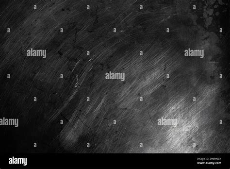 Black Scratched Metal Texture In Low Light Background Stock Photo Alamy