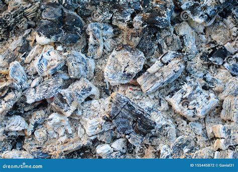 Hot Coals Covered In Ashes Background After Burning Fire Stock Photo