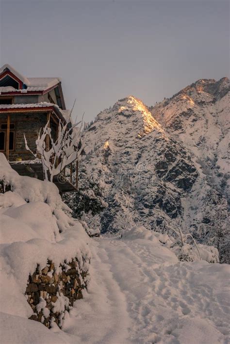 Snow Covered Wooden House In Mountains Majestic Winter Landscape In