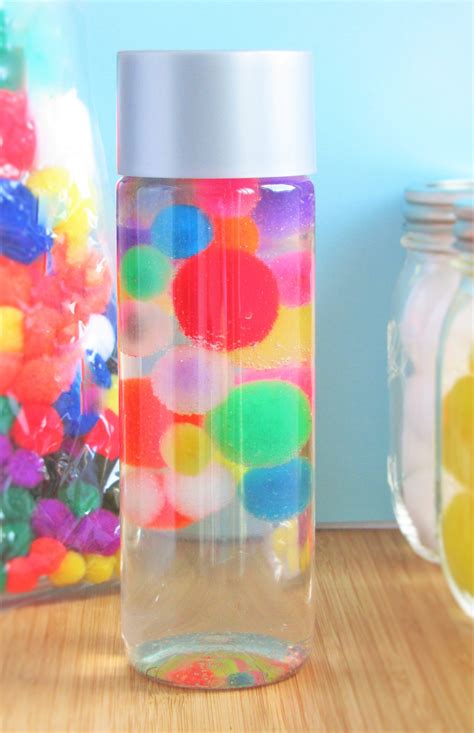 Our Crystal Clear Floating Pom Poms Sensory Bottle Is A Fun Relaxation