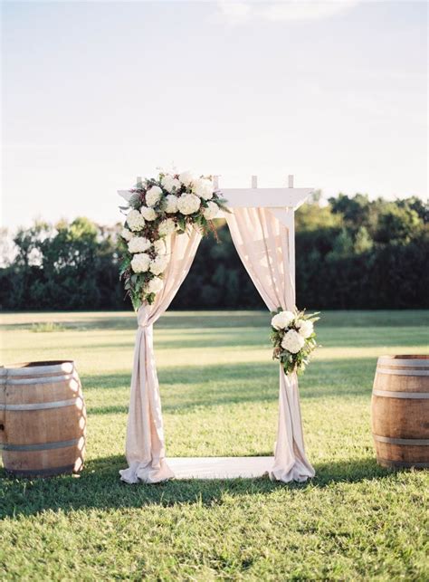 Beautiful Simplicity Wedding Arch With Fabric Draping Greenery