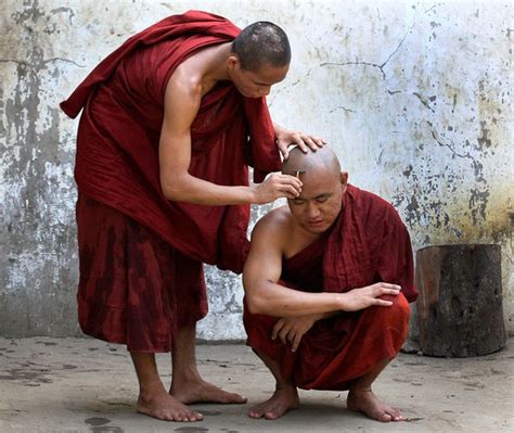 A Myanmar Buddhist Monk Shaves A Fellow Monk S Head In Yangon Myanmar