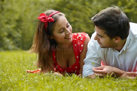 Couple In Love Lying On The Grass In The Park Stock Image Image Of Cheerful Lifestyle 63206365