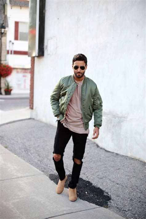 A funky blue suede chelsea boot with red side gusset. Green bomber jacket + taupe t-shirt + black distressed ...