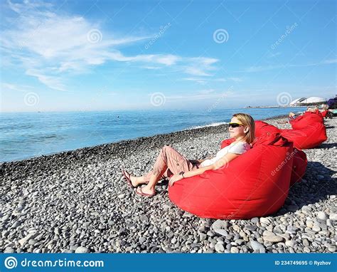 Woman On Rocky Beach By The Sea Stock Image Image Of Romantic Summer
