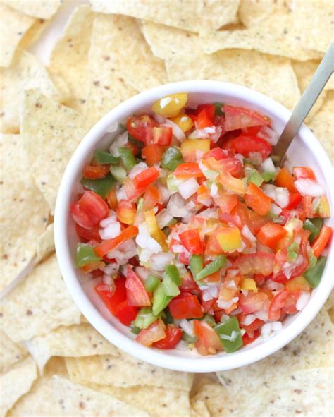 A few key ingredients like fire roasted tomatoes, seasoning, fresh cilantro, and lime juice blend together to make an incredibly mouthwatering restaurant style salsa. homemade salsa recipe (cilantro free!)