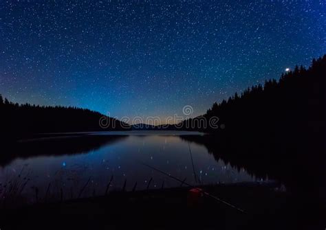 Night Landscape With Starry Sky Above A Mountain Lake Stock Photo