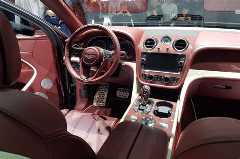 The Interior Of A Car With Red Leather Seats