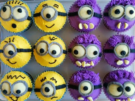 Cupcakes With Yellow And Purple Frosting Decorated As Minion Faces On A