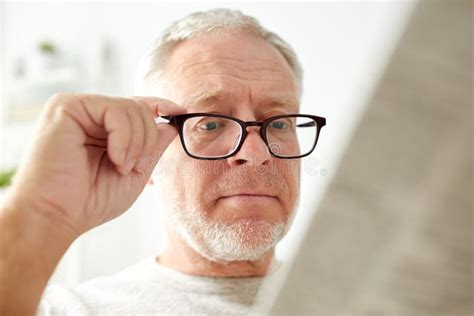 Close Up Of Old Man In Glasses Reading Newspaper Stock Image Image Of Information Living