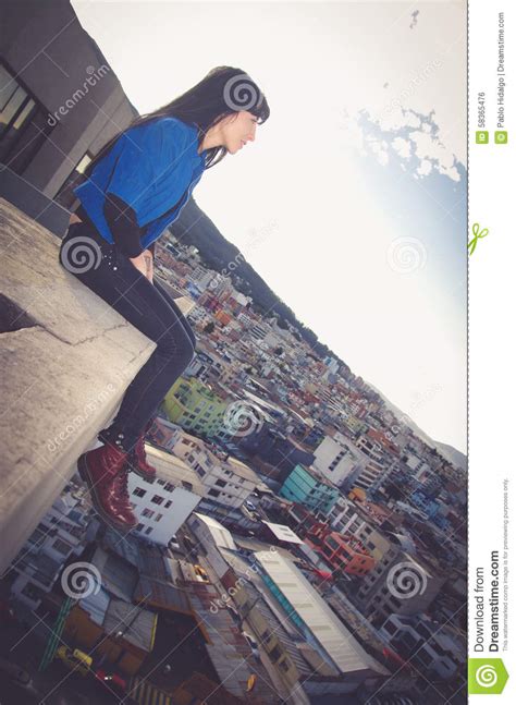 Beautiful Young Girl Sitting On The Roof Looking Stock Photo Image Of