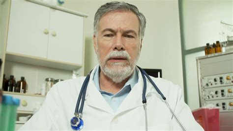Doctor Looking At Camera In A Video Conference Stock Video Footage 00