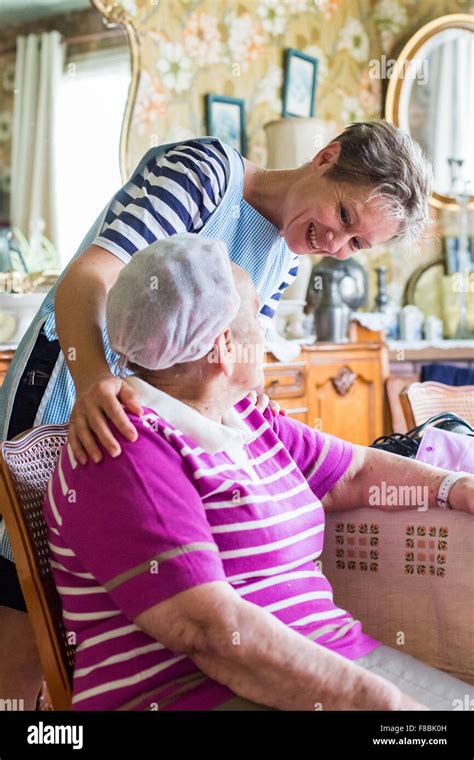 Home Care Aid Assisting Elderly Woman Dordogne France Stock Photo Alamy