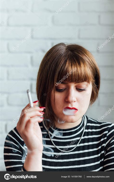 Pretty Woman Smoking — Stock Photo © Kikovic 141591760