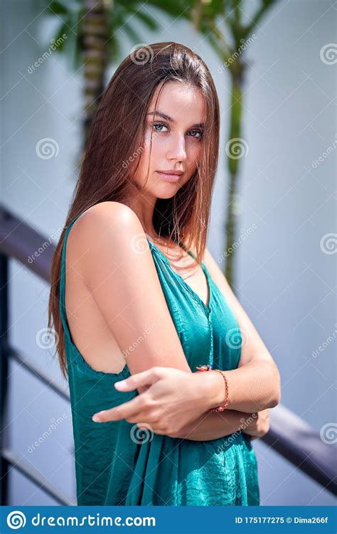 Close Up Portrait Of Beautiful Girl In A Green Dress Stock Image