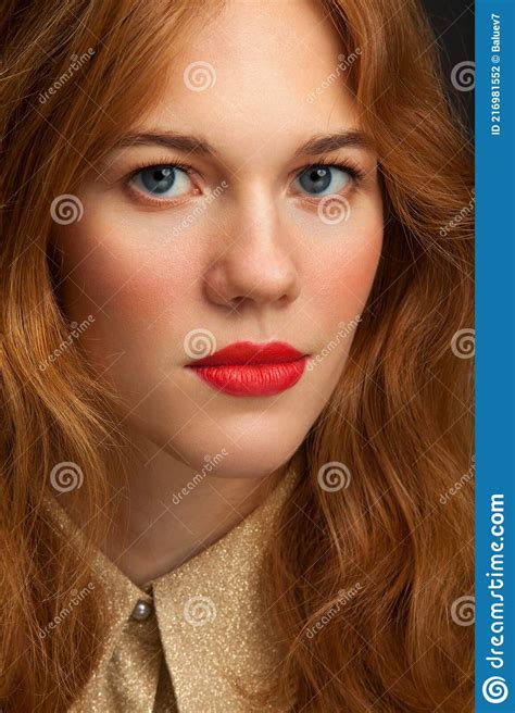 Young Red Haired Girl Looks At The Camera Portrait Of A Young Woman