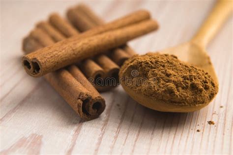 Cinnamon Whole Sticks With A Heap Of Powder Stock Photo Image Of