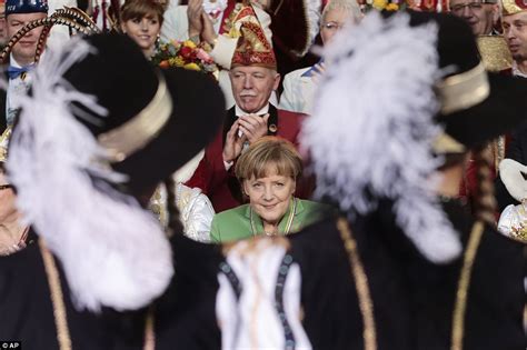 German chancellor angela merkel has blamed her country's difficulties during the coronavirus pandemic on a tendency toward perfectionism. Angela Merkel looks away as female dancers perform the ...