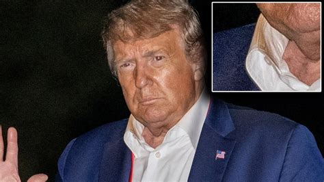 humiliated trump spotted with orange makeup smeared all over his shirt collar