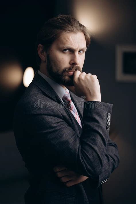 Portrait Of Handsome Man In Formal Wear Standing At Office Stock Photo