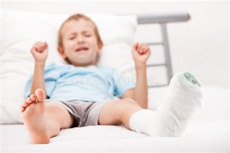 Little Child Boy With Plaster Bandage On Leg Heel Fracture Or Br Stock