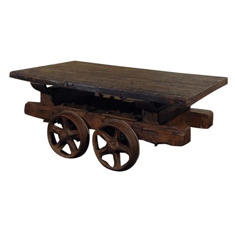 (coffee tables) while any small and low table can be, and is, called a coffee table, the term is applied particularly to the sets of three or four tables made from about 1790; Antique Rail Cart Coffee Table at 1stdibs
