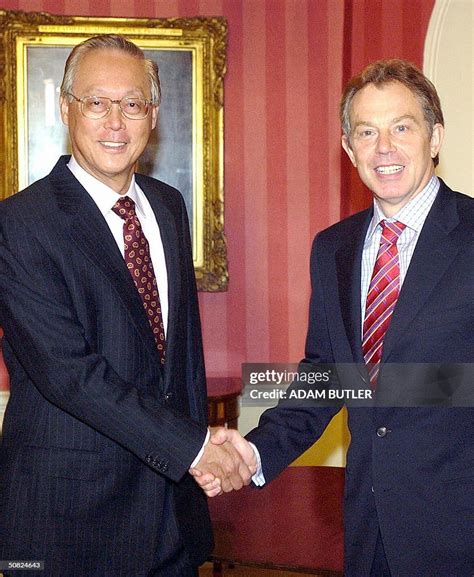 Britains Prime Minister Tony Blair Shakes Hands With Singaporean