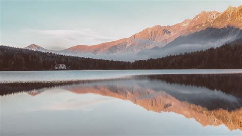 1360x768 Clear Lake Mountains Sunrays Water Reflection 4k Laptop Hd Hd