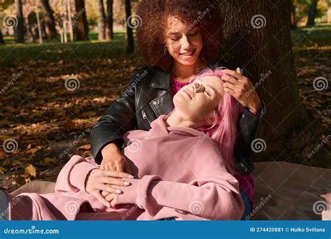 romantic lesbian couple resting in park on sunny autumn day stock image image of homosexuality