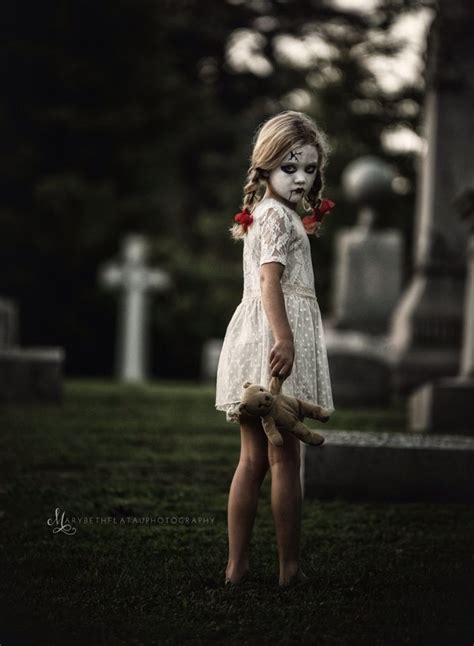 Creepy Halloween Costume Girl With Teddy Bear In Graveyard