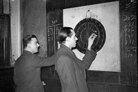Practice darts with our growing amount of games: Two Men Play Darts For A Pint Of Beer In A 1930 London Pub ...
